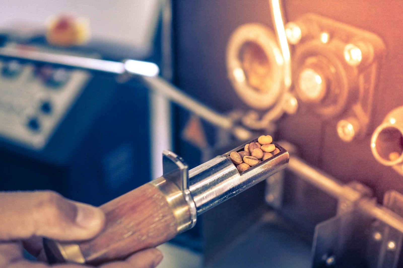 Detailed view of coffee beans being roasted in a professional coffee roaster.